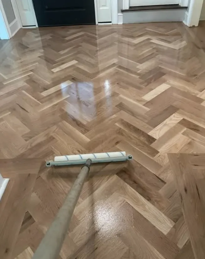 Homeowner damp mopping a hardwood floor